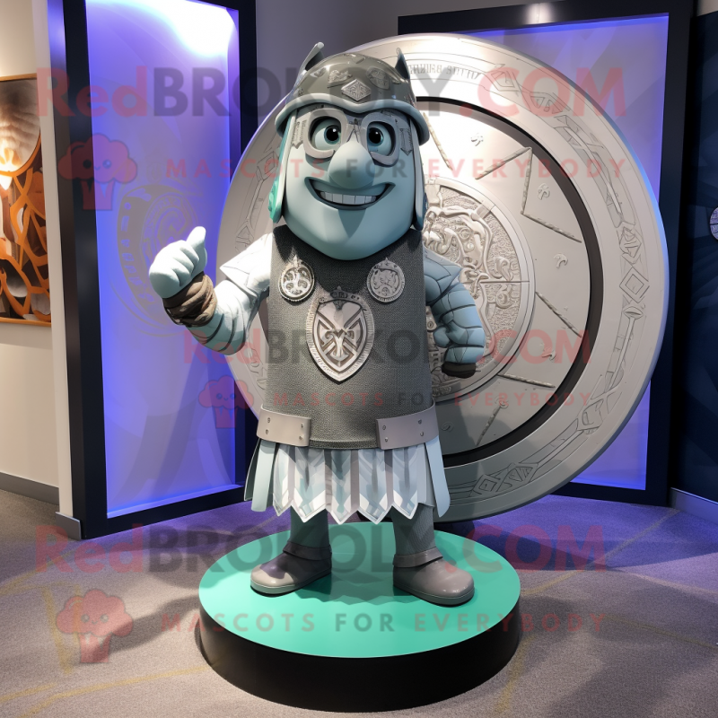 Silver Celtic Shield mascot costume character dressed with a Graphic Tee and Pocket squares Silver Celtic Shield mascot costume character dressed with a Graphic Tee and Pocket squares