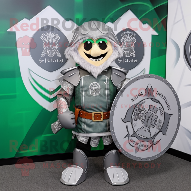 Silver Celtic Shield mascot costume character dressed with a Graphic Tee and Pocket squares Silver Celtic Shield mascot costume character dressed with a Graphic Tee and Pocket squares