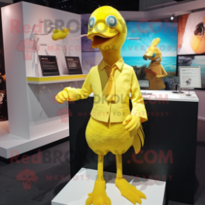 Yellow Dodo Bird mascot costume character dressed with a Mini Skirt and Cufflinks