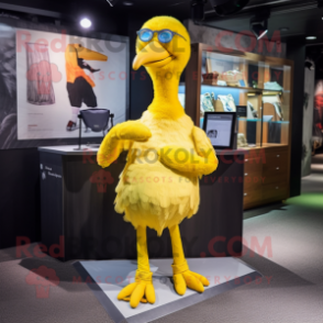 Yellow Dodo Bird mascot costume character dressed with a Mini Skirt and Cufflinks