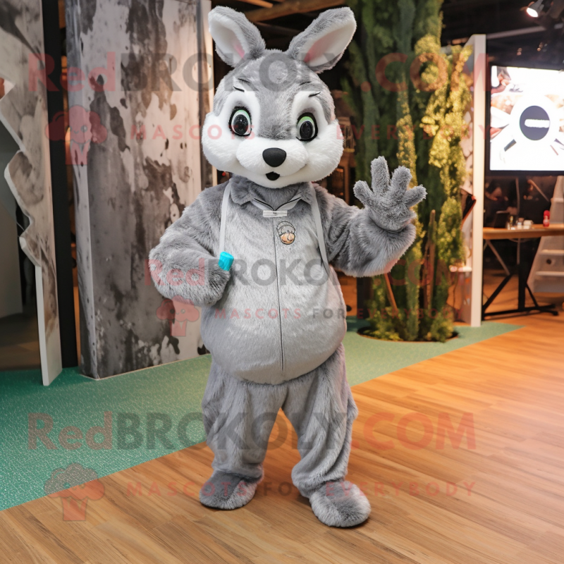 Silver Wild Rabbit mascot costume character dressed with a Jumpsuit and Handbags Silver Wild Rabbit mascot costume character dressed with a Jumpsuit and Handbags