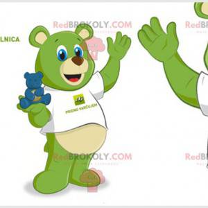 Mascota del oso de peluche verde con ojos azules. Osito de