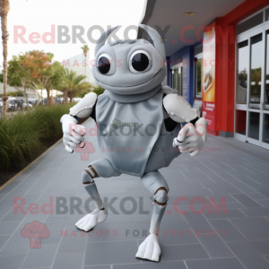 Silver Crab mascot costume character dressed with a Running Shorts and Messenger bags