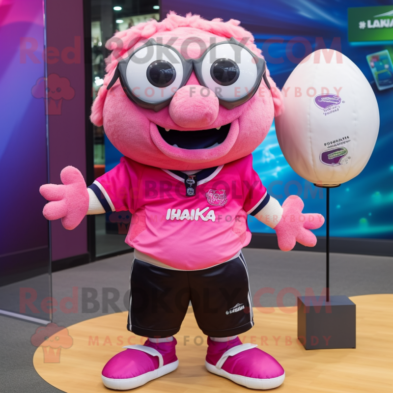 Pink Piranha mascot costume character dressed with a Rugby Shirt