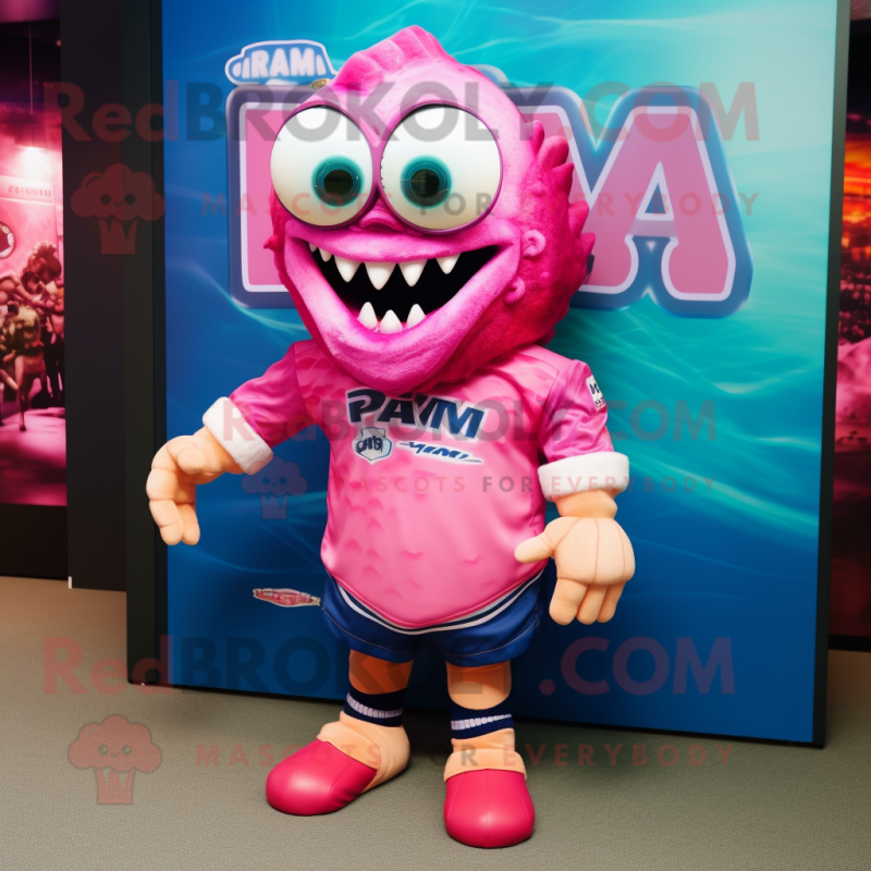 Pink Piranha mascot costume character dressed with a Rugby Shirt and Sunglasses Pink Piranha mascot costume character dressed with a Rugby Shirt and Sunglasses