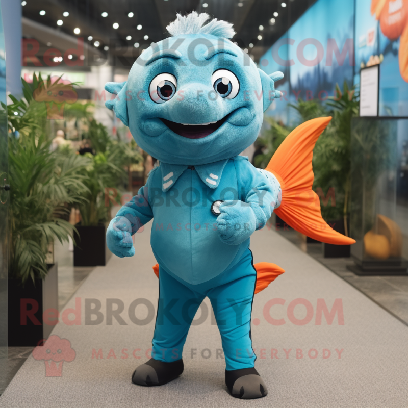 Turquoise Goldfish mascot costume character dressed with a Jeans and Cufflinks