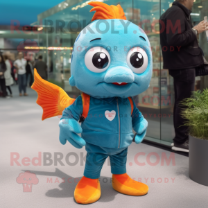 Turquoise Goldfish mascot costume character dressed with a Jeans and Cufflinks