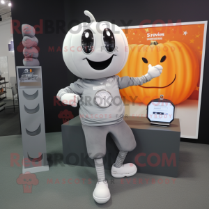 Silver Pumpkin mascot costume character dressed with a Henley Tee and Digital watches