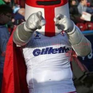 Mascotte de chevalier avec un casque et une cape rouge -