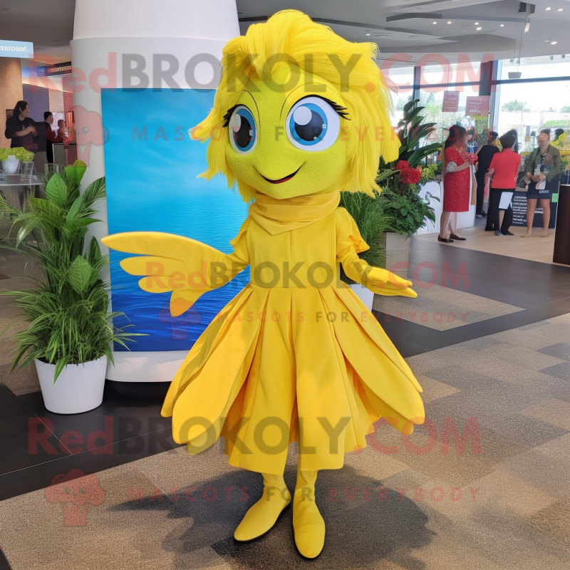 Yellow Betta Fish mascot costume character dressed with a Shift Dress and Shoe clips