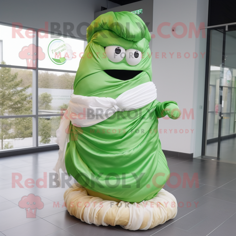 Green Croissant mascot costume character dressed with a Wedding Dress and Scarf clips Green Croissant mascot costume character dressed with a Wedding Dress and Scarf clips