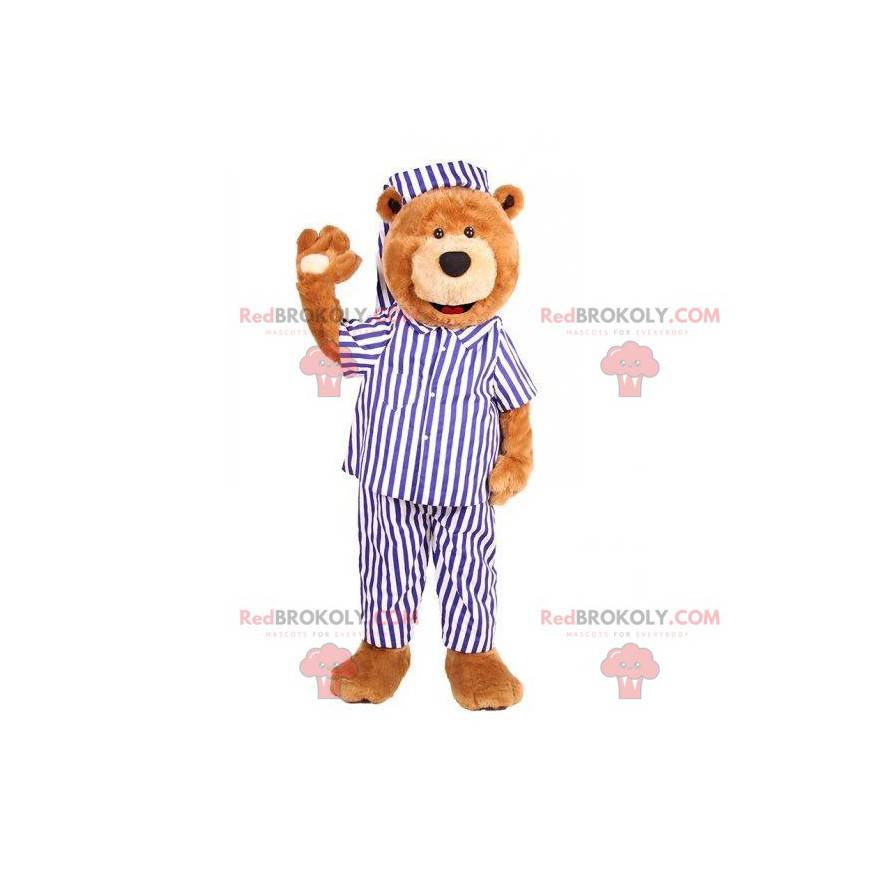 Mascota del oso de peluche vestida con un pijama azul y blanco