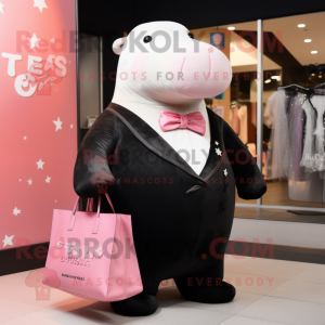 Pink Stellar'S Sea Cow mascot costume character dressed with a Tuxedo and Tote bags