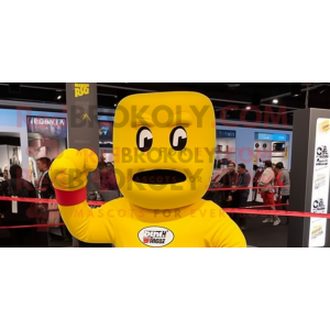 Yellow Boxing Glove mascot costume character dressed with a Sweatshirt and Anklets