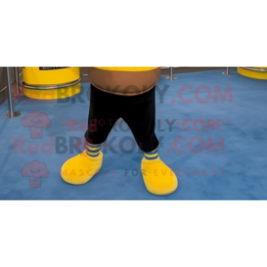 Yellow Boxing Glove mascot costume character dressed with a Sweatshirt and Anklets