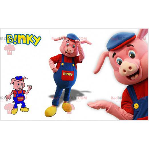Różowa maskotka świnia z niebieskim kombinezonem i beretem -