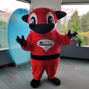 Red Killer Whale mascot costume character dressed with a Jumpsuit and Wraps
