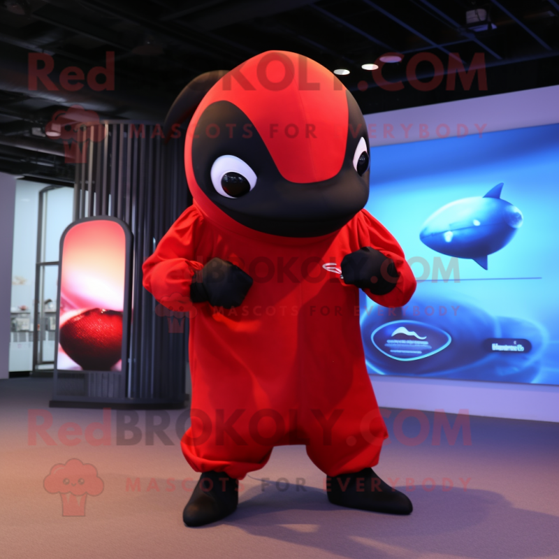 Red Killer Whale mascot costume character dressed with a Jumpsuit and Wraps