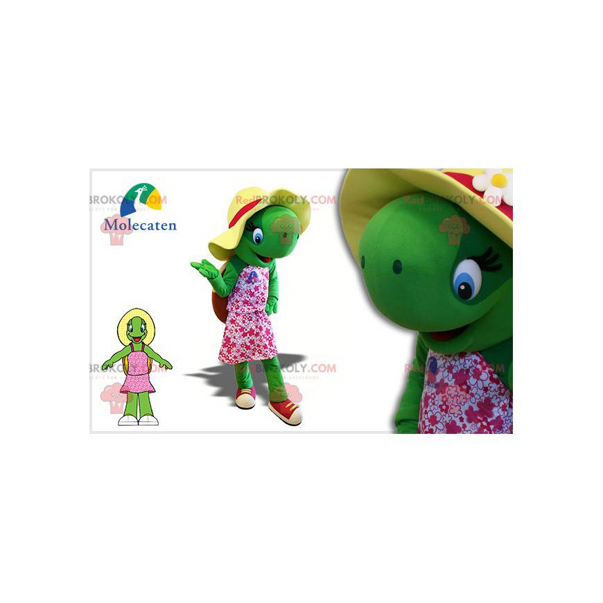 Mascota de la tortuga verde con un sombrero y un vestido rosa -