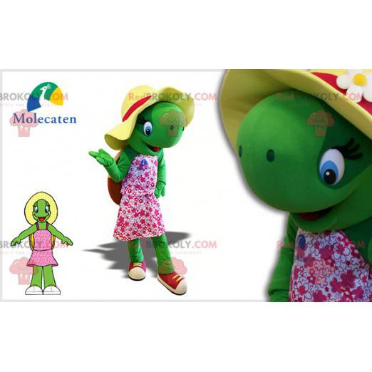 Mascotte tartaruga verde con un cappello e un vestito rosa -