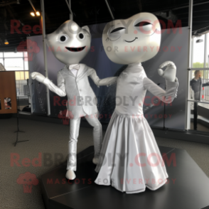 Silver Trapeze Artist mascot costume character dressed with a Wedding Dress and Pocket squares