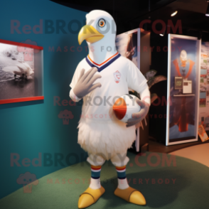 Cream Pigeon mascot costume character dressed with a Rugby Shirt and Rings