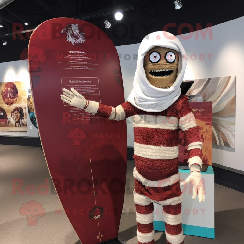 Maroon Mummy mascot costume character dressed with a Board Shorts and Lapel pins Maroon Mummy mascot costume character dressed with a Board Shorts and Lapel pins