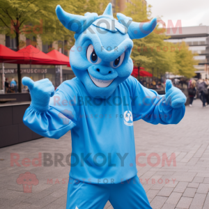 Sky Blue Devil mascot costume character dressed with a Windbreaker and Headbands