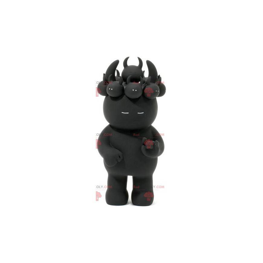 Mascotte de diablotin noir avec des petits sur la tête -