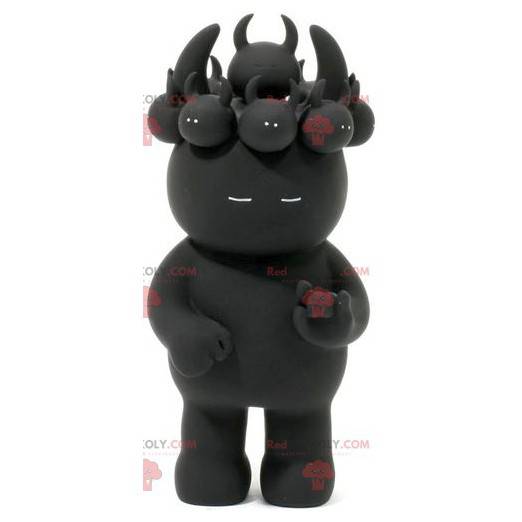 Mascotte de diablotin noir avec des petits sur la tête -