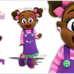 Mascotte bambina africana con un vestito colorato -