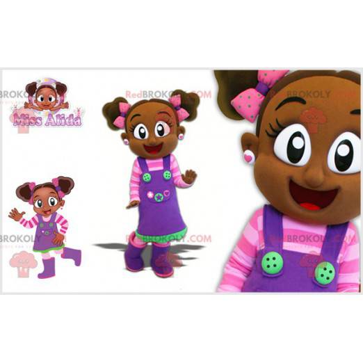 Mascotte de petite fille africaine avec une tenue colorée -