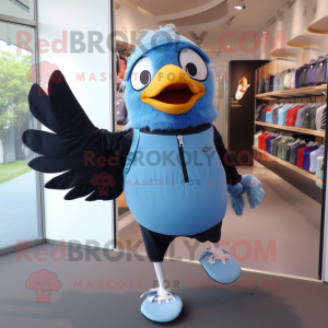 Sky Blue Blackbird mascot costume character dressed with a Running Shorts and Backpacks