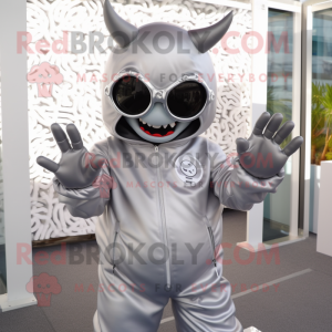 Silver Demon mascot costume character dressed with a Windbreaker and Sunglasses