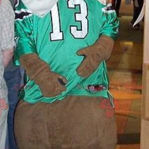 Brown bear mascot with a green and white sports jersey -