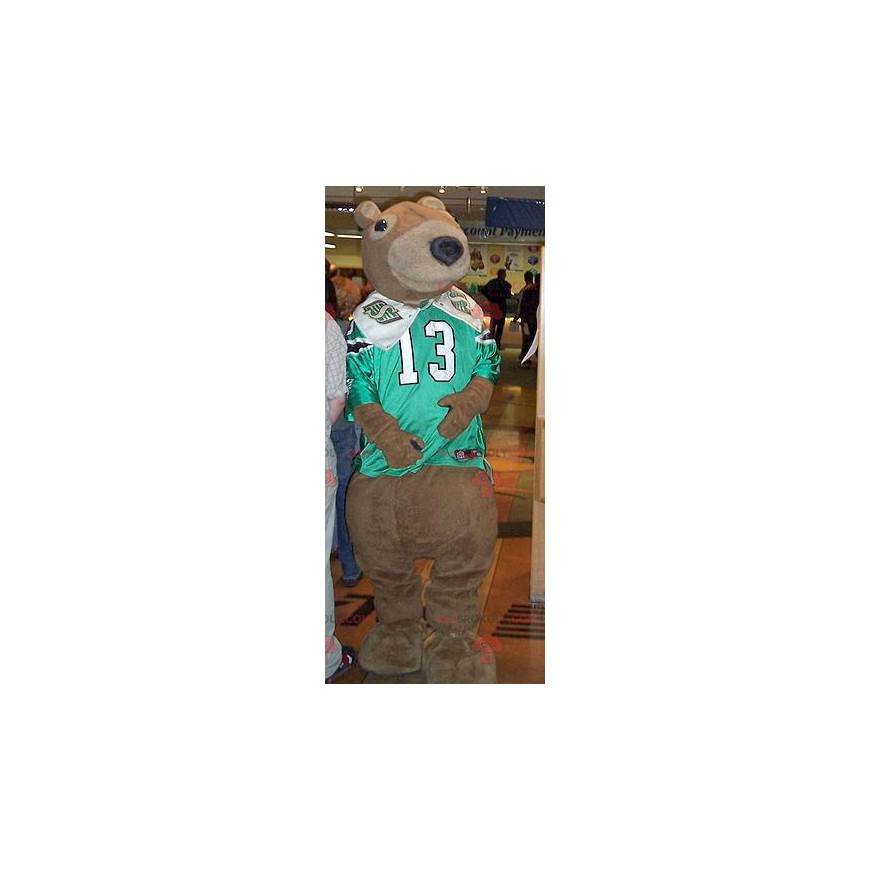 Brown bear mascot with a green and white sports jersey -