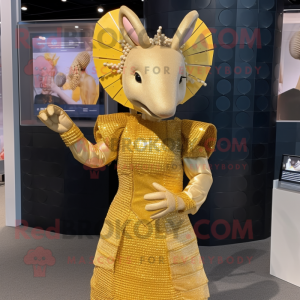 Gold Armadillo mascot costume character dressed with a Shift Dress and Hair clips