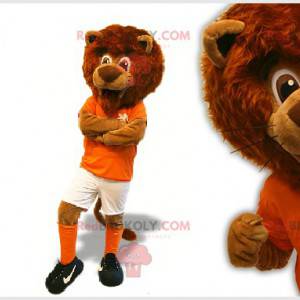 Mascota del león marrón en traje de futbolista - Redbrokoly.com