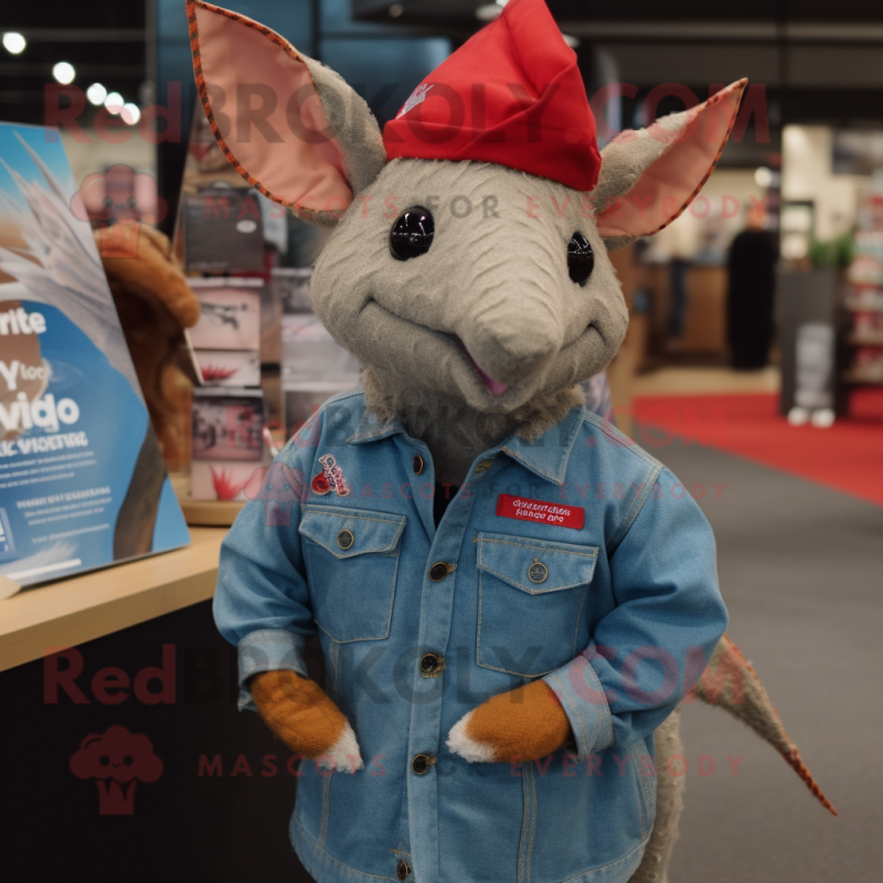 Red Armadillo mascot costume character dressed with a Denim Shirt and Shawl pins