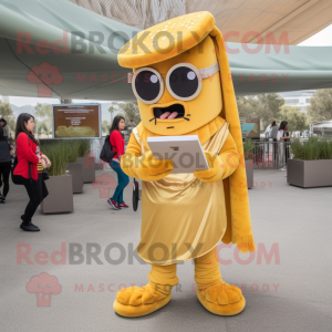 Gold Enchiladas mascot costume character dressed with a Chinos and Reading glasses