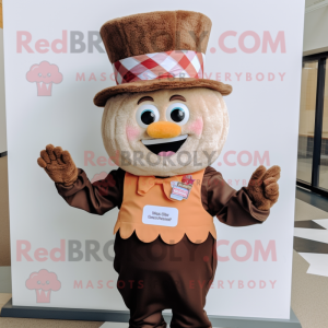 Brown Cupcake mascot costume character dressed with a Vest and Hats