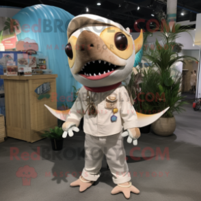 Beige Swordfish mascot costume character dressed with a Romper and Necklaces