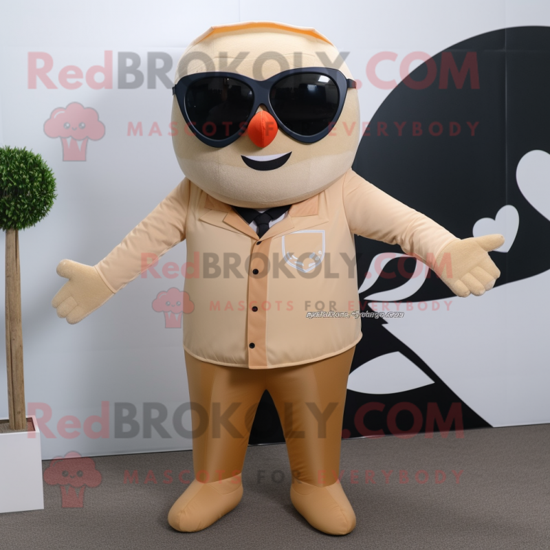 Tan Arrow Of Love mascot costume character dressed with a Suit Pants and Sunglasses Tan Arrow Of Love mascot costume character dressed with a Suit Pants and Sunglasses