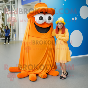Orange Cyclops mascot costume character dressed with a Maxi Skirt and Berets