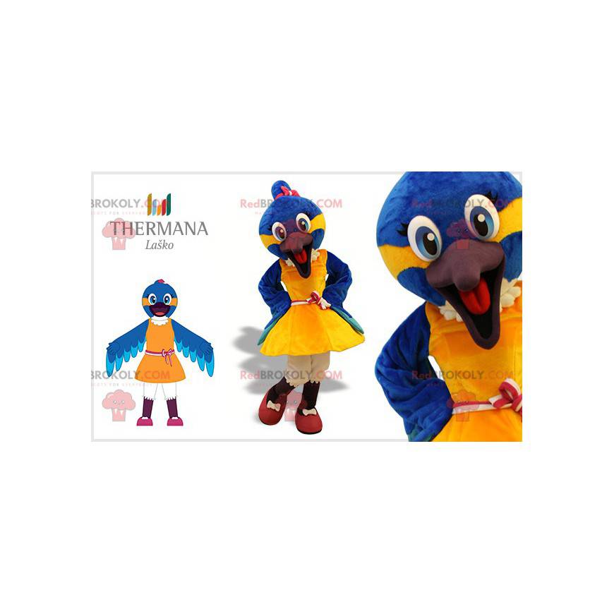 Blaues und gelbes Vogelmaskottchen mit einem Kleid -