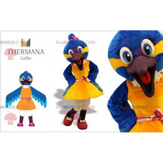Mascote pássaro azul e amarelo com um vestido - Redbrokoly.com