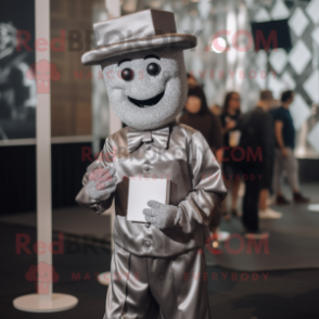 Silver Chocolate Bar mascot costume character dressed with a Dress Pants and Berets