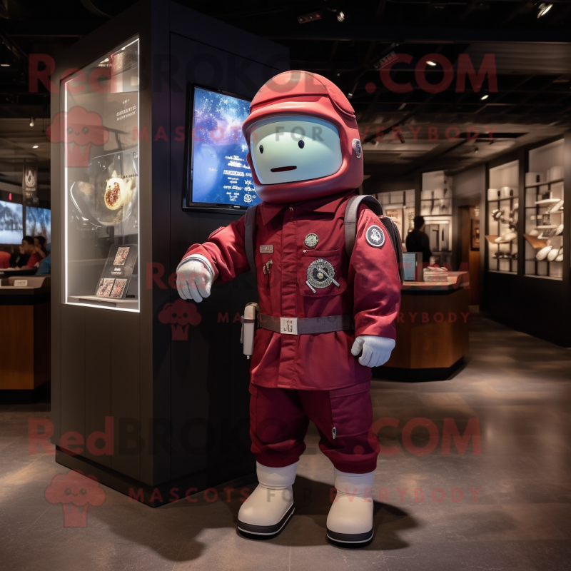 Maroon Astronaut mascot costume character dressed with a Chambray Shirt and Berets