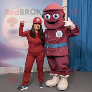 Maroon Astronaut mascot costume character dressed with a Chambray Shirt and Berets