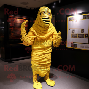 Postava maskota žluté mumie...